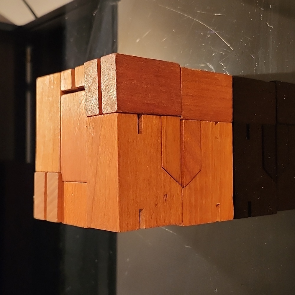 A wooden robot block puzzle.